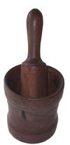 Beautiful turned wooden mortar and pestle set American, 19th century,walnut having a slight hourglass form with incised decorative bands; . In a dark, rich patina; 12" high including the pestle x 5.75" diameter