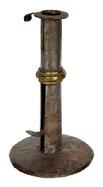 M117 Late 18th century Hog Scraper Wedding ring / band Candlestick with wide flat rim with finger curl at the top and working push-up tab bearing an illegible makers stamp. Sturdy sheet iron, hand forged construction with brass wedding band. Dark, natural surface. Circa 1790-1800. Measurements: 3 ½ diameter base x 6 ¼ tall.