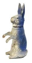 M1163B 19th century papier m&acirc;ch&eacute; rabbit candy container depicting a Rabbit sitting upright. Head lifts off. Has stick legs with a hand painted nose and mouth and blue painted accents to its coat. Unmarked. Measures ~1 &frac34;� wide x ~2 &frac12;� deep x 6 &frac14;� tall.  