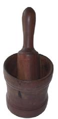   X313 Beautiful turned wooden mortar and pestle set American, 19th century,walnut having a slight hourglass form with incised decorative bands; . In a dark, rich patina; 12" high including the pestle x 5.75" diameter 