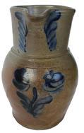 D154 Decorated Stoneware Chicken Waterer, circa 1850, straight-sided form with rounded top and tall finial, with attached handles and open, hooded watering section.This example was probably made at the Remmey Pottery