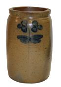 Q439 Peter Herman Crock, This crock was made in Baltimore circa 1850 to 1870. It is decorated in cobalt with a two-stemmed, flowering plant,  The crock has an attractive, smooth-sided shape , with the 1 1/2 gallon stamped about the flowers. 11 1/2" tall