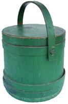 T286 New England green painted Firkin, tongue and grooved staves, Tapered lap joint wooden bands., bent wood handle with wooden pegs. Great surface wear meadsurements are: 9 1/4" dia. x 9 1/2' tall