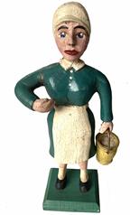 G699 Folk Art carved wooden Milk maid with pail. Carved details include individual posed arms/hands, individual legs, shapely figure, fingers/fingernails, distinct facial features, carved bonnet, dress with collar and apron, and a shaped wooden milk pail with metal handle.
