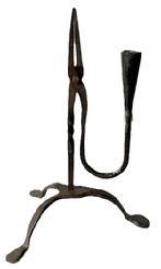 **SOLD** L237 Fantastic 19th century wrought Iron Rush Light / Candle holder with twisted center post and candle cup counterbalance arm resting on arched tripod base with pad feet. Hand forged iron.Measurements: 9 ½ x 7 5/8 across the spread of the feet x 12 ¾ tall.
