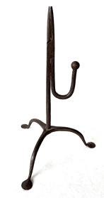 J214 18th century rare diminutive American wrought iron rush light with tripod base resting on hand forged padded feet. Great original surface. Sturdy, sits level and is in wonderful working condition. Measurements: 10" tall and is 6 1/2" - 7" across pad feet, depending on where measured.