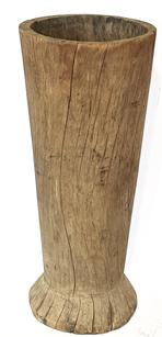 J390 Very tall, hand-hewn, heavy wooden mortar from Wicomico County, Maryland. Natural patina surface with age cracks and wear indicative of years of extensive use. Measurements: ~13 1/2" diameter (top) x ~12 1/2" diameter (bottom) x 31 1/2" tall. The inner well is ~17 1/2" deep