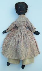 LL154 Late 19th century Or early 20th century hand-sewn Black Americana "Mammy" doll. All the body is hand stitched including torso, fingers, face, and the looped yarn wig is sewn on. Stuffed with cotton.. The clothes are hand-sewn as well, white & red dress with lace slip, and bloomers. All the hems are hand done. . Doll is about 22" long. $375.00