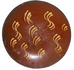 LL147 Early Pennsylvania redware plate yellow slip decoration and great wear  circa 1850 12" diameter