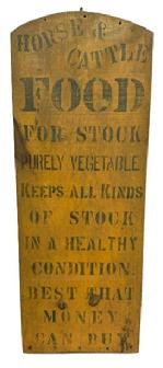 M322 Single sided wooden sign that reads: �Horse & Cattle Food For Stock� �Purely Vegetable� �Keeps All Kinds Of Stock In A Healthy Condition� �Best That Money Can Buy�. Original green painted letters and edges on a mustard yellow background. Found in Pennsylvania. Measurements: 13 &frac14;� wide x 78� thick x 35 &frac34;� tall.  