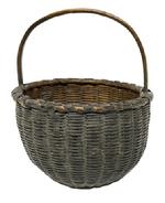 M273 Early 19th century Pennsylvania small sized hand-woven berry basket bearing its wonderful original olive green painted surface. Single wrapped double rim with tightly woven sides. The wooden steamed and bent, notched handle is sturdy and tight. In good condition with great surface. Measurements: The 6 &frac12;� � 7� top diameter diameter circular opening tapers down to rest on a 3 &frac12;� round base. Sides are 4 &frac14;� - 4&frac12;" tall, depending on where measured. Overall height at top of handle is 8 &frac14;� tall.