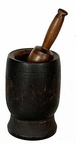 H952C 19th century turned wooden Mortar and Pestle in original black painted surface. Nicely turned shape with simple incised ring around the outside and a molded interior lip surrounding the opening of the Mortar. Natural patina interior. 