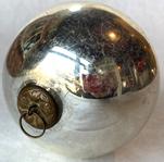 G888 Large Silver ball Kugel ornament - Hand blown glass -  nice weight and great condition with original cap and ring. Made in Germany between 1840 and early 1900. The silver kugels are actually clear glass with mirrored interiors to give them the metallic appearance. The word "kugel" means "round ball" in German,but they were also made in the shapes of Grapes, Apples, Berries, Pears, Tear Drops, Pinecones and Ribbed Melons. Silver, gold and green � which brilliantly reflected candlelight, were the most popular colors. Measures 4" diameter.