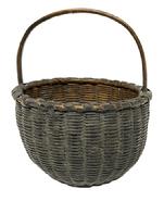 M273 Early 19th century Pennsylvania small sized hand-woven berry basket bearing its wonderful original olive green painted surface. Single wrapped double rim with tightly woven sides. The wooden steamed and bent, notched handle is sturdy and tight. In good condition with great surface. Measurements: The 6 ½ 7 top diameter diameter circular opening tapers down to rest on a 3 ½ round base. Sides are 4 ¼ - 4½" tall, depending on where measured. Overall height at top of handle is 8 ¼ tall.