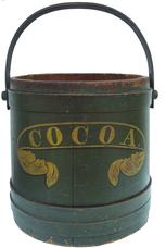 W43  Outstanding 19th century  Pennsylvania firkin still retains it's original dark green  painted surface and stenciling the word  "Cocoa" in mustard paint.  The bands are held in place with rose head nails,  bent wood handle with wooden pegs  Completely original without repairs.  .Great for anyone who collects stencilled pantries and firkins.  it  measures 12-1/2" tall