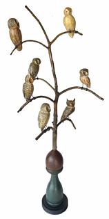 **SOLD** H468 - American, 20th Century Folk Art Owl Tree, with seven different beautiful hand carved and polychrome painted wooden Owls resting on steamed and bent branches. Mounted in a colorful, multi-tiered base for display.  Signed, and branded on bottom, "Ken Kirby". This Owl tree stands 35" tall. It is 15 ¼� across at the widest branches. (Base measures 5" diameter x 12 ¼� tall)
