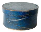 **SOLD** RM1557 19th century New England small sized original dry blue painted pantry box with opposing fingered body and lid. Tacked and wooden pegged construction. Interior bears natural surface patina. Measurements: 4 ¾ diameter x 2 ½ tall.