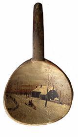 H481 19th century hand painted wooden butter paddle depicting a snow scene with a house with snow covered roof, fence and barren trees, along with a person on a horse surrounded by three small dogs in the lane.