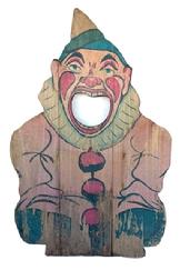 G388 Early 20th century wooden tossing game. The face of a Clown lithographed on the wood panel with hole in his mouth. Try to throw a ball in his mouth to determine your score. Measurements: 15 3/4" wide x 24 1/4" tall x 3/4" thick.  