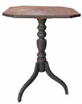 D675 Early 19th century New England Federal Period black painted candle stand. The legs are dovetailed into the pedestal that features nice, bold turnings and retains early black paint over the original red paint. Circa 1800  1820.