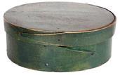 L353 Exceptional mid-19th century New England steamed and bentwood oval pantry box retaining its original green painted surface. Opposing finger lapped construction secured with tacks and tiny square head nails. Clean interior. Measurements are: 5 ¼ x 4 oval x 2 tall.