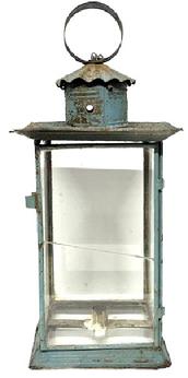 M1112 19th century large candle Lantern bearing original old blue painted surface. Lantern is glass and tin construction with a hinged door, smoke ventilator chimney bearing a crimped cover and round tin handle with folded edges attached to top with heavy wire. The thick pane of glass in the door has an early break that does not affect the integrity of the lantern. This lantern is unique in that it also has a glass bottom. The internal candle socket is supported via a tin band with rolled edges that is soldered to the frame. Measurements: 9� x 9� x 20&frac34;� tall to top of handle. 