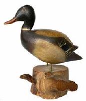 G519 Early 20th century beautifully carved miniature mallard drake in original paint and excellent condition. Mounted on a piece of wood. Probably 1930 -1940.Signed on bottom �Mallard RG Cape Cod�.