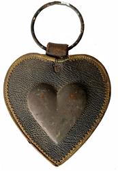 H274 Civil War era heart-shaped brass and leather Martingale with original ring. This style of Martingale adorned the breast plate of Civil War saddles. Brass shaped heart is applied to a heart-shaped leather pad with detailed stitching and applied decorative leather border around the edges. Great condition! Measurements: Outer leather pad is 5 ½� tall x 5� wide and 7 ½� tall with ring. Ring is 2 ½� diameter. Brass center heart is 2 ½� wide x 2½� tall. 
