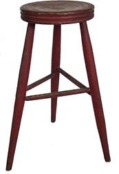 H293 18th century three leg stool with the original dry red paint , with a thick  round top  with hand turned in lines around the sides of the top  and great splay to  legs. The stool has original, red paint with great wear to the top.  Circa 1790. Top measures 25 ½ " tall x 17 ½ " wide 
