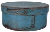 **SOLD** K1841 Exceptional mid-19th century New England steamed and bentwood oval pantry box retaining its original blue painted surface. Opposing finger lapped construction secured with tacks and tiny square head nails. Clean interior. Measurements are: 9 ½ x 7 ¼ oval x 4 ¼ tall. 