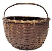 M274A Sturdy 19th century tightly hand-woven round gathering basket with single wrapped rim in original dark red painted surface. Thick steamed and bent, notched handle is woven into the sides of the basket. Tightly woven, significantly bumped up bottom interior to help with weight distribution and enhance airflow for gathered items. Minor losses with great wear. Measurements: 15 &frac12;� x 14 &frac12;� diameter across top x 8 &frac12;�-9� tall sides (depending on where measured) x ~13 &frac12;� tall with handle. 