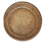 L512 Wooden plate with extensive wear on edges and "P" carved into the bottom of the slightly raised foot. Natural patina surface. Out of round. Measurements: 7 ¼ x 7" diameter x ~ ¼ - ~ ½ tall, depending on where measured.