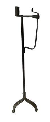 K118 18th century rare, non-adjustable hand forged Floor Standing Wrought Iron Rush Light with Candle Holder. Simple round stem with arched tripod base resting on hand forged slight padded feet. Circa 1750  1780. Measurements: 5 ½ wide at candle socket x 8 ½ across feet x 30 ½ tall.   