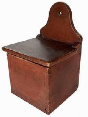 B637 Early 19th century Pennsylvania Salt Box with the original red paint. Dovetailed case featuring an arched back with hole for hanging. The wood is walnut. Circa 1820. Measurements: 12 1/4" tall x 8" wide x 7 1/2" deep