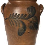 E416  19th century  2 gallon blue decorated stoneware butter churn, Baltimore, MD circa 1850-70.  two handles and bold double flowers on front and back. The crock stands  11" tall