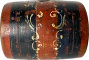 **SOLD** H1060 Early 19th century paint decorated oval shaped personal wooden keg � embellished with incised rings. Original red with blue painted bands and white hand painted decorations, retaining the date �1824� painted in white on one end and initials �HSD� painted on the opposite end.  Retains hole on top where stopper / cork was used to hold liquid contents inside. Hand carved. Fantastic condition � with wear indicative of use. Measurements: 3 3/8� deep x 3 7/8� wide x 3� tall  