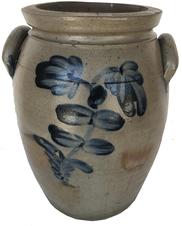 E243 STAMPED "P. HERRMANN.", BALTIMORE, MARYLAND DECORATED STONEWARE JAR, salt-glazed, "3" gallon capacity mark, semi-ovoid form with squared rim, beaded neck ring, incised shoulder ring, and arched handles. Brushed cobalt floral decoration to each side, additional cobalt at handle terminals. The pottery of Peter Herrmann (1825-1901), Baltimore, MD. Circa 1875. 13 1/8" H, 7 3/4" D rim.