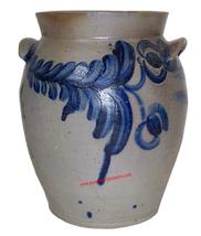 This 1 1/2 gallon stoneware jar is decorated all around with bright cobalt blue flower decoration. It was made in southeastern PA or Baltimore, MD, c1860.10 1/2 '" tall