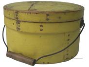 T160 Yellow painted wooden Pantry Box, with over lapping bentwood sides, secured with small metal tacks. The sides of the Box are fitted with a pair of oval stamped tin  handle mounts. Fitted with an arched wire swing handle with wooden hand grips.( 3/4 diameter x 5 1/2" tall