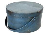L97 Early 19th century New England wooden bail handle Pantry Box bearing the original dark blue painted surface. Heavy construction with tacked lap joints and a bentwood swing handle that is secured with wooden pegs. Clean, natural patina interior with the name May Swanson written on tape inside the lid.
