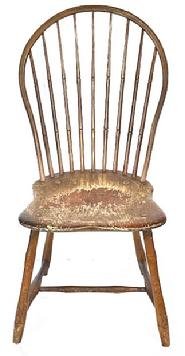 L122 19th century Pennsylvania Bow Back Windsor chair with nine spindle back and bamboo turnings in old mustard paint over original red painted surface. Great wear from years of use. Measurements: 17 wide across front of seat x 16 ¼ deep seat x 36 ½ tall back. The seat is 16 ½ tall.
