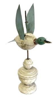 M280 Original painted Folk Art Duck Weathervane. Wooden body with tack eyes and tin tail and wings. Mounted in an original white painted architectural wooden base for display purposes.  Measurements: ~14 &frac34;� long x 4 &frac14;� wide (tail). Overall mounted height is ~20� tall.  
