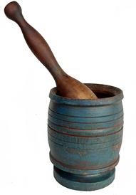 J272 Beautiful blue painted Mortar and Pestle featuring detailed band-style turnings and a footed base. Measurements: 4 3/4" diameter x 6 1/4" tall. Pestle measures 11 1/4" long.