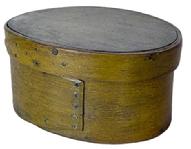 **SOLD** K1840 Mid-19th century New England steamed and bentwood oval pantry box retaining its original mustard painted surface. Opposing finger lapped construction secured with tacks and tiny wooden pins. Clean, natural patina interior. Measurements are: 7 x 5 1/8 oval x 3" tall. 