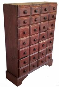 G118 19th century Pennsylvania red painted tall Apothecary Chest with twenty-eight drawers, the drawers are nailed construction, and rest on an applied base, with a nice high cut out apron. The drawer fronts are chamfered. The overlapping drawer fronts act as a drawer stop. Circa 1880. Measurements are: 31 ½ wide x 11 tall x 42 tall.