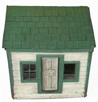 H507 Adorable folk art wooden doll house with removable paneled door, glass windows, individual wooden shingles on the roof and wooden lap siding exterior. Retains old green and white painted surface. Natural patina wooden plank floor and finished walls inside.