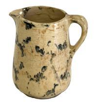 CM7 Small Spongeware Salt Glazed Pitcher featuring teal and tan colored sponge decoration on an ivory- colored background. No chips or cracks. Crackling to surface indicative of age. Measurements 4 ½ tall and rests on a 2 ½ diameter footed base.