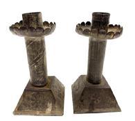 RM1594 Unique early pair of handmade tin candlesticks with embossed decorations and tapered, square weighted bases. Embossed diagonal lines adorn the center stems, embossed floral decorations adorn the bases and each drip cup is surrounded with a scalloped edge. Rolled edges with tight soldering joints throughout. Measurements: Bases are 2 ¾ square and overall height of each one is 5 ¼ tall