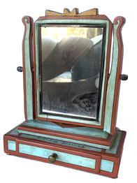 F723 Folk Art Tabletop shave mirror with a tiltable mirror and drawer, in it's original paint of blue and red and mustard with "Birthday greetings" written above the drawer , and the person Initial in a triangle (M.S. or S.M. ) on the top