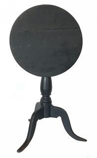 RM1399 � 18th century tilt top candlestand retaining original paper label underneath that reads �Milton Litchfield County Connecticut�. Old black paint over the original red painted surface. Solid wooden baluster turned column with three highly arched dovetailed legs.